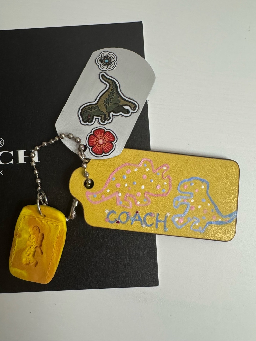 Coach customized yellow dinosaur hangtag bundle